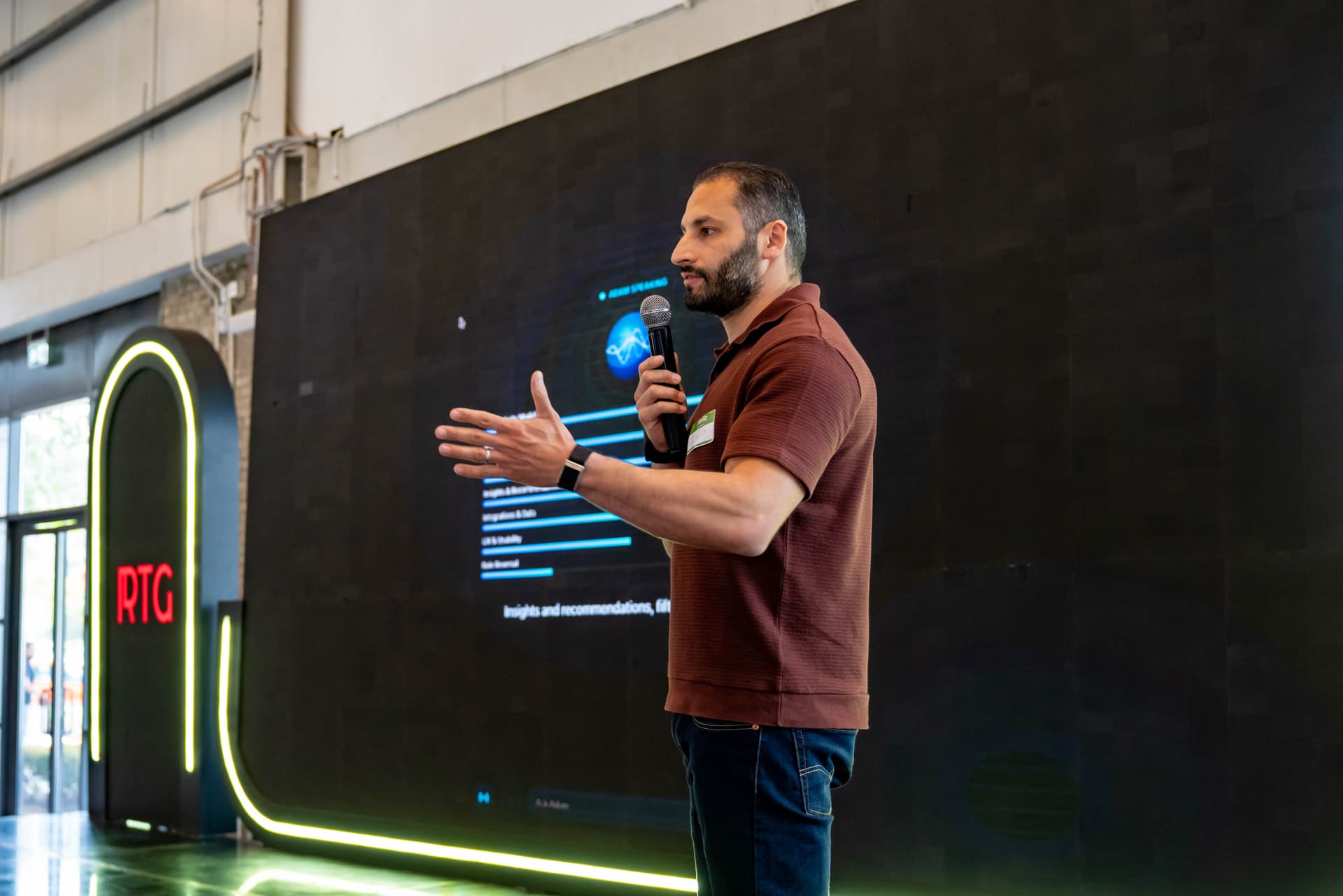 Presenter on stage at RTG Hackathon 2026